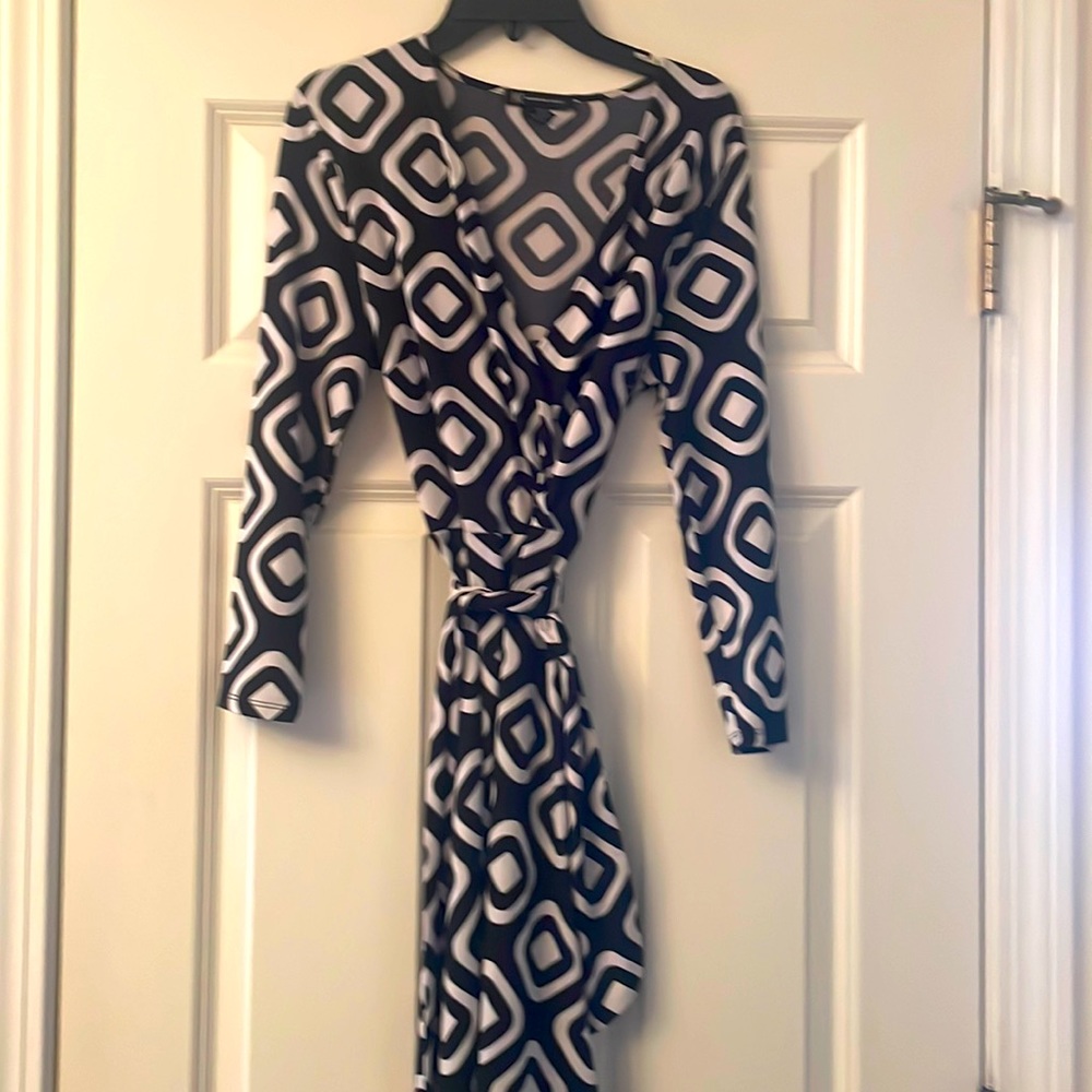 INC size medium, black, and white wrap dress